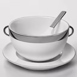 white plate and bowl on table, silver spoon in the bowl