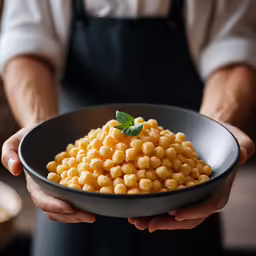 a person holds a bowl with some food in it