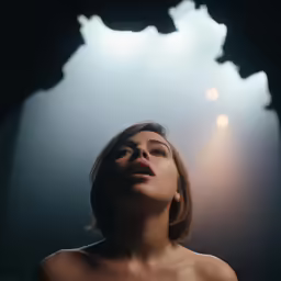 the woman is up in the dark with her eyes closed