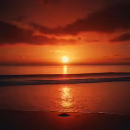 an orange sunset on a beautiful day over the ocean