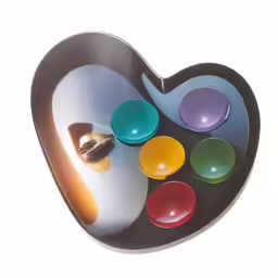 a heart shaped plate holding a painting of different colors