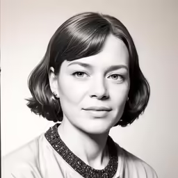 a woman in a dress posing for a photo