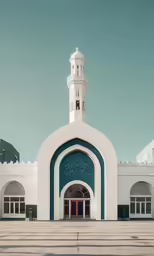 a white building with green door and a clock tower