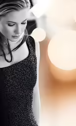a woman is texting on her phone near several circles