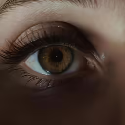 a person with large brown eyes