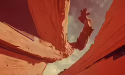a person standing up against some red walls