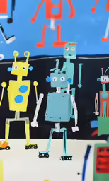 paper cutouts of robots are on display