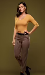 a woman wearing pants with her hands on her hips