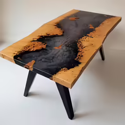 a very pretty wooden table with black paint
