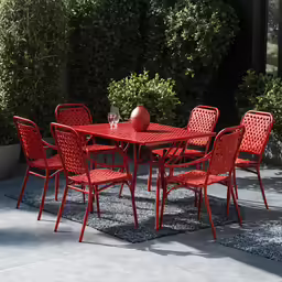 a red table with several red chairs next to it