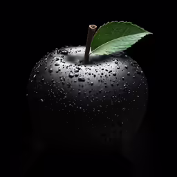 the apple is dark and has drops of water