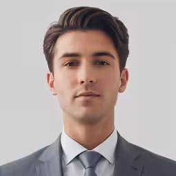 a man in a suit posing for the camera