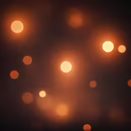 blurry lights of orange and yellow colors are shown