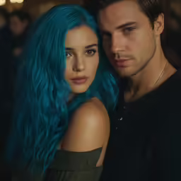 young couple in blue hair taking picture together