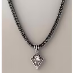 a pendant with a diamond on a silver chain