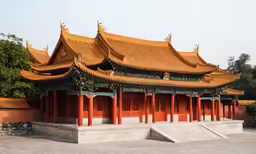 a chinese structure that is red and brown