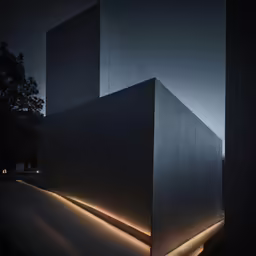 a modern building lit by an outside light