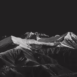 some mountains with some snow on top