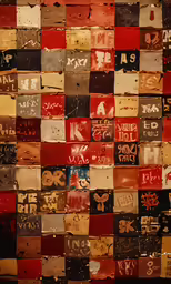 various colored tags are used to write on a brick wall
