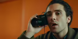 a young man taking a picture with his camera