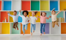 a group of children jumping into the air