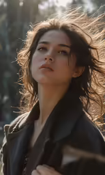 a beautiful woman is holding a frizzy hair