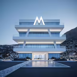 the building with lots of windows has a large water pool in front of it