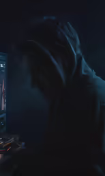 the computer user is shown staring at a computer screen