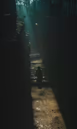 a person sits in the dark on a bench