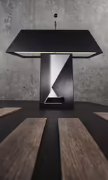 an interesting, modern lamp is lit with an interesting light fixture