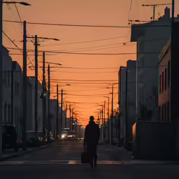 a person that is walking on the street with a suitcase
