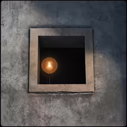 a light bulb glowing inside of a concrete box