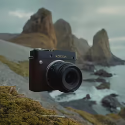a view of the beach and the rocks and water from a camera
