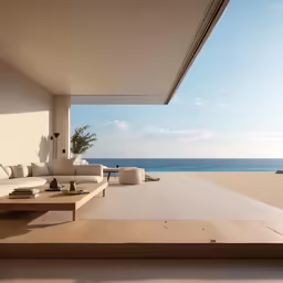 the ocean is beyond a house on the beach