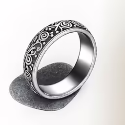 the ring is laying on top of a stone