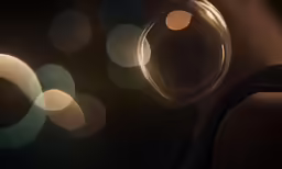 blurred bubbles are shown on a black background
