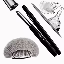 a black and white image of makeup brushes, a brush, razor blade, and a shaving razor