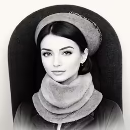 black and white portrait of a woman wearing a hat and scarf