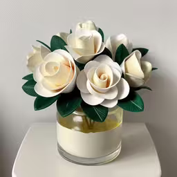 a white glass jar with some flowers inside,a close up of a flower arrangement in a vase on a shelf
