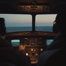 view from cockpit of small airplane flying through dusk