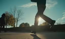 the man is walking outside with his foot up on the sidewalk