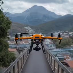 a yellow and black remote controlled flying over a bridge
