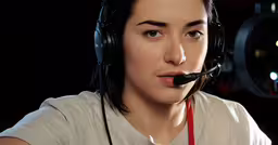 a man wearing a headset with a microphone,a person in headset with an earphone on