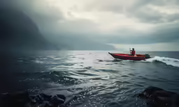 the man is in the boat out on the water