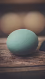 some soft stones sitting on a wood surface