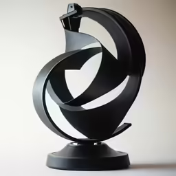 a metal sculpture with a curved sculpture on top