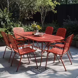there is an outdoor dining table and chairs in the yard