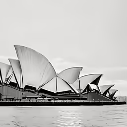 a black and white photo of the sails of the opera house