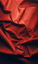 there is red cloth that has a texture