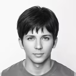 the young man is wearing a grey t - shirt
